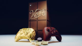 A chocolate bar-themed Xbox Series X and two controllers, one wrapped in gold foil and the other a brown colour