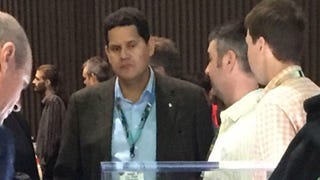 Let's enjoy this incredible photo of Nintendo's Reggie Fils-Aime looking at the Xbox S
