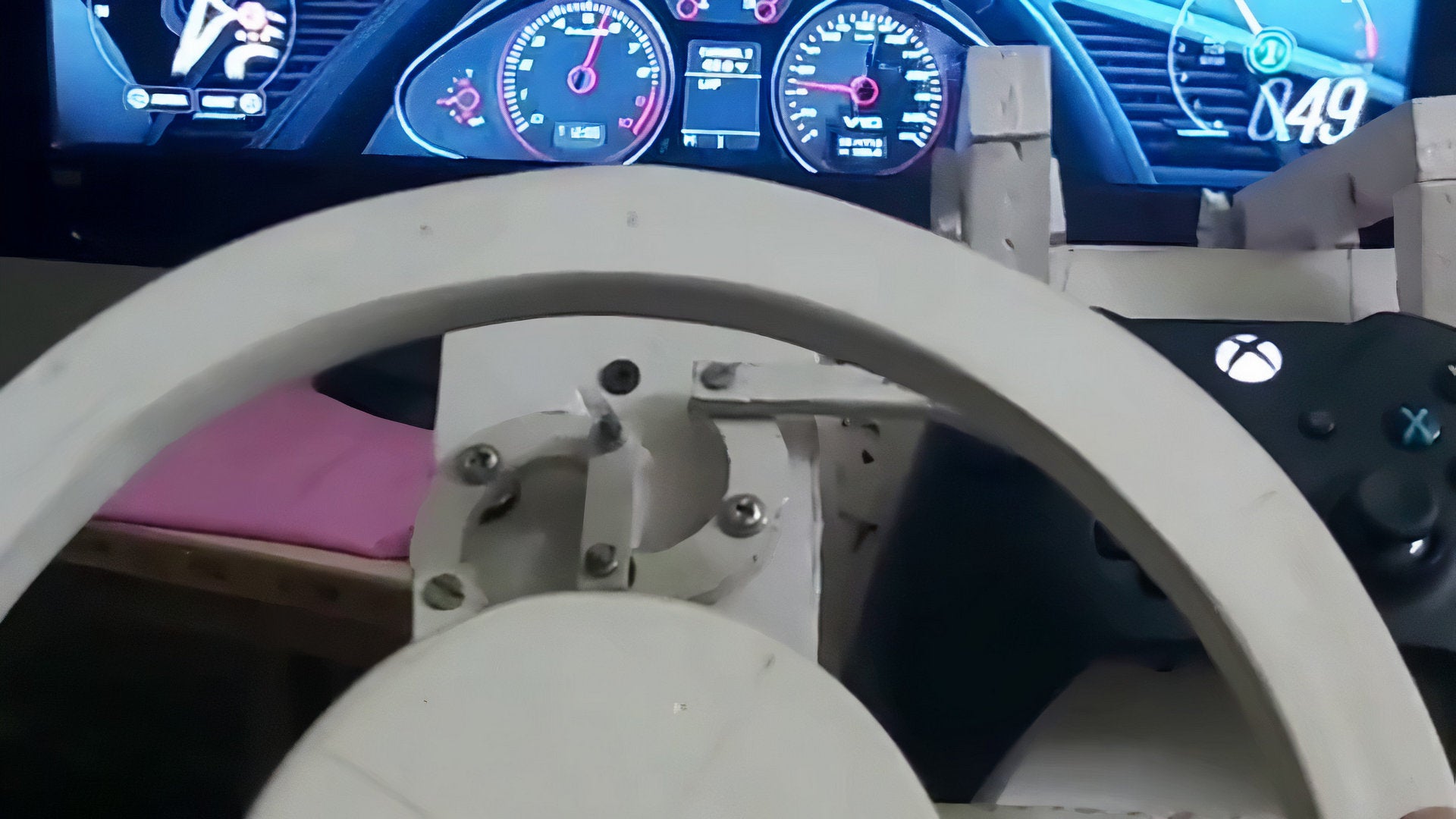 A close up of a handmade wheel made of wood for the Xbox