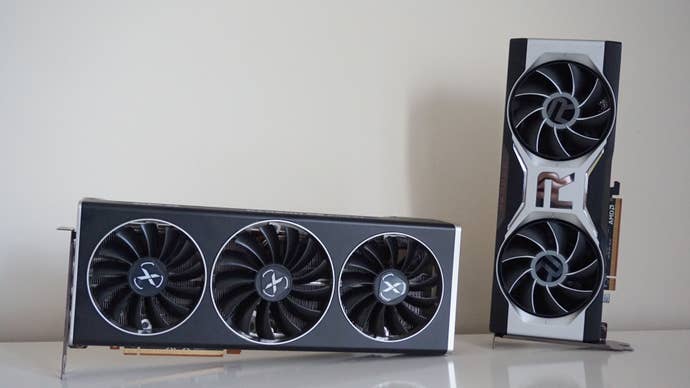 XFX’s Radeon RX 6700 XT Speedster Merc 319 Black Edition graphics card next to AMD’s Radeon RX 6700 XT graphics card