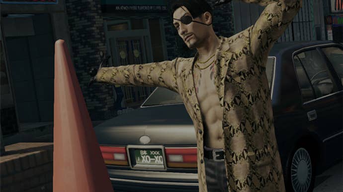 Yakuza screenshot showing Majima in snake skin shirt next to a giant fraffic cone