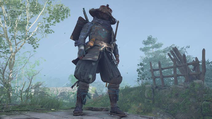Yasuke stands wearing a cool bamboo hat and purple pirate’s armour in Assassin’s Creed Shadows.