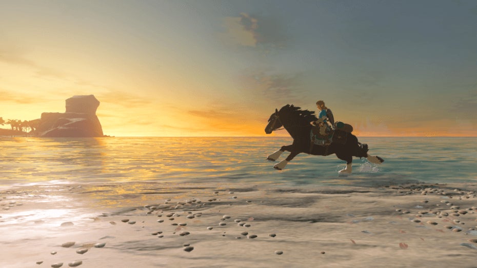 Breath of the Wild screenshot showing Link riding a galloping horse from right to left along the beach during a glorious sunset