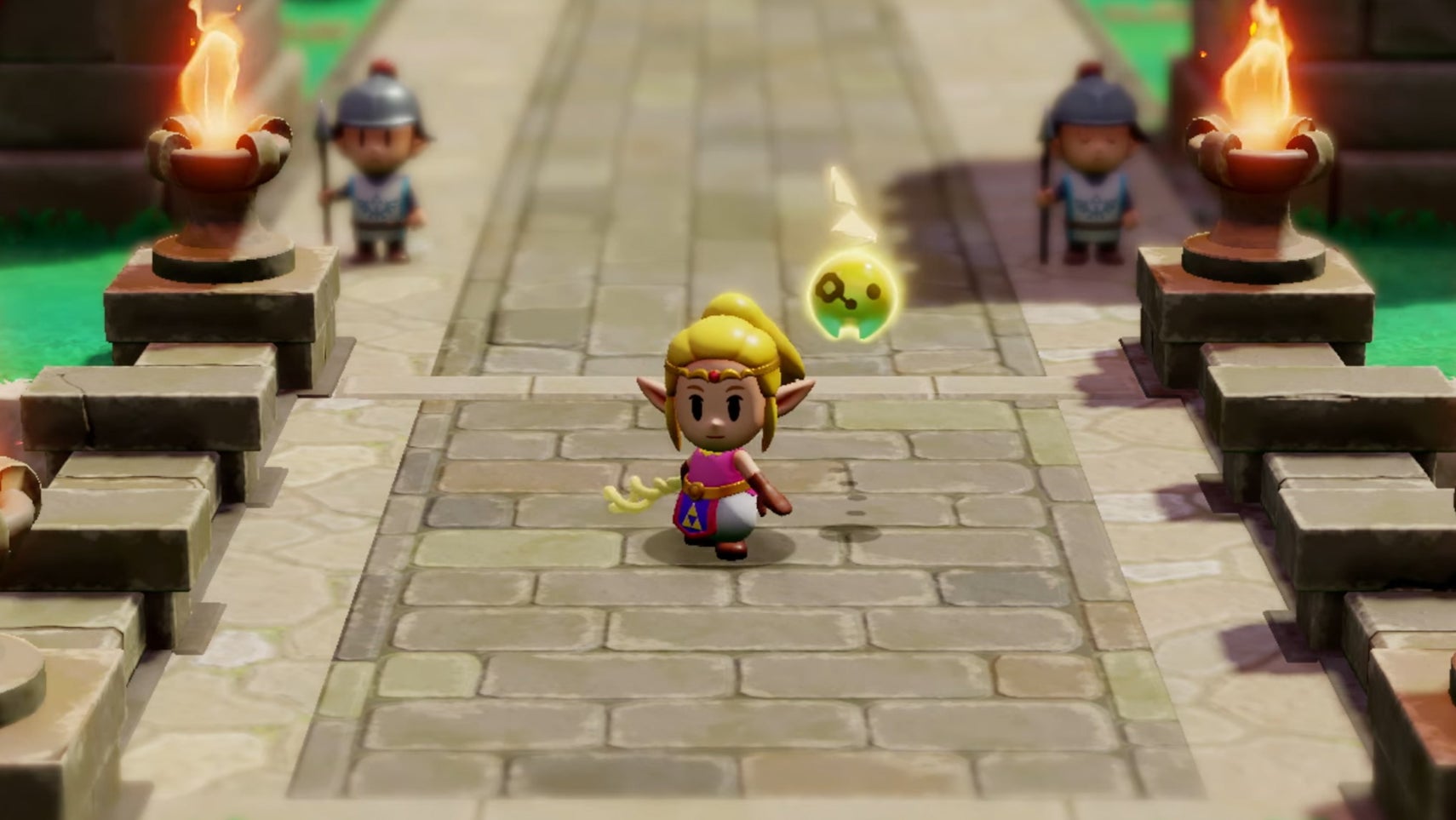 Zelda in a casual outfit with her hair tied back stood on a bridge near some guards in The Legend of Zelda: Echoes of Wisdom. - 1