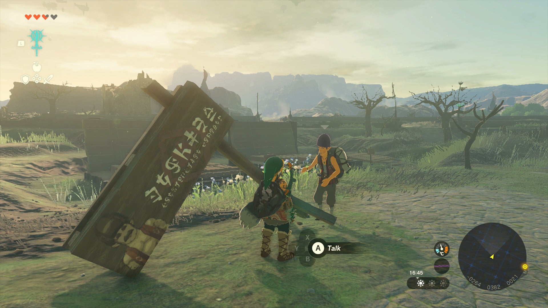 Link and Addison standing next to a fallen sign in Zelda: Tears of the Kingdom - 1