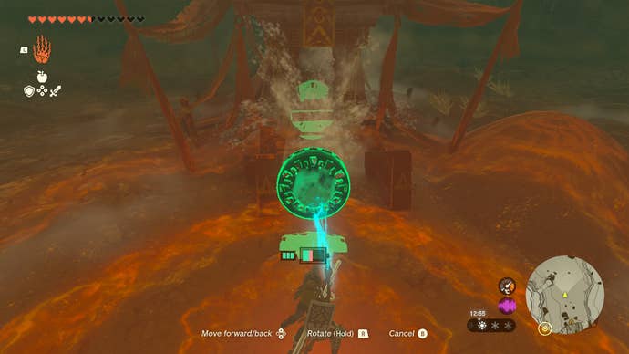 Link using a fan to blow sand off a treasure chest in Zelda: Tears of the Kingdom