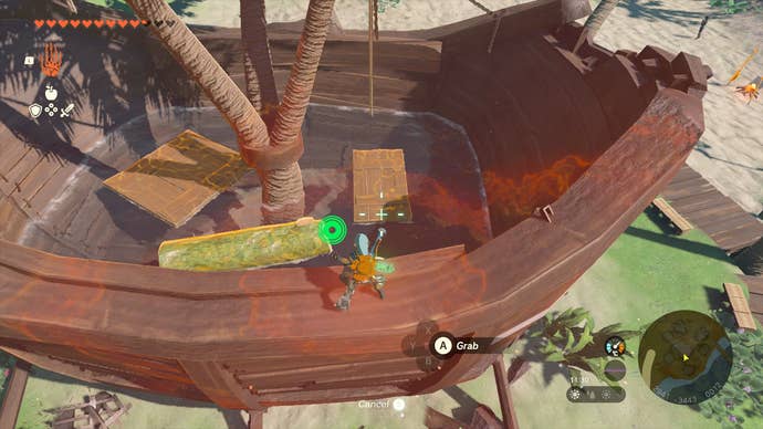 Link removing debris from inside the Inn in Lurelin Village in Zelda: Tears of the Kingdom