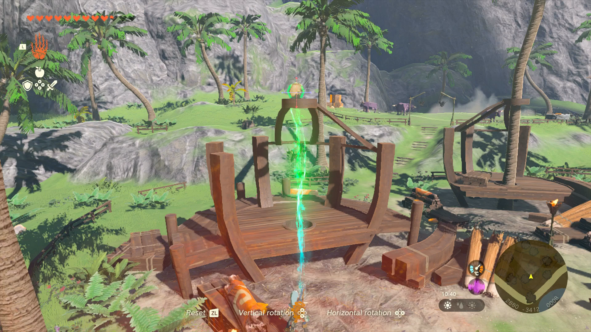 Link manipulating a palm tree trunk into place on the restaurant in Lurelin Village in Zelda: Tears of the Kingdom