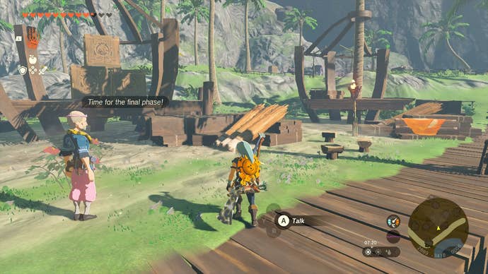 Link moving some boxes out of the restaurant in Lurelin Village in Zelda: Tears of the Kingdom