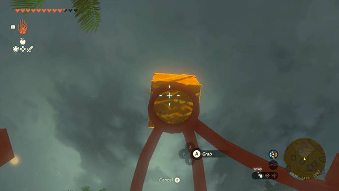 Link carrying a box off the roof of the Lurelin Village Head's house in Zelda: Tears of the Kingdom