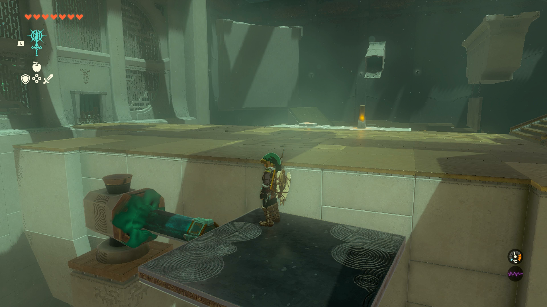 Link riding a platform over a high ledge in Mayachin Shrine in Zelda: Tears of the Kingdom