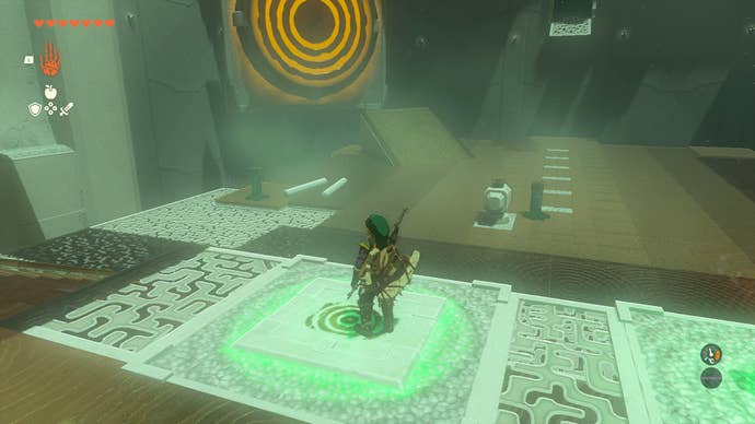 Link pressing a button to reveal a giant target in Mayachin Shrine in Zelda: Tears of the Kingdom