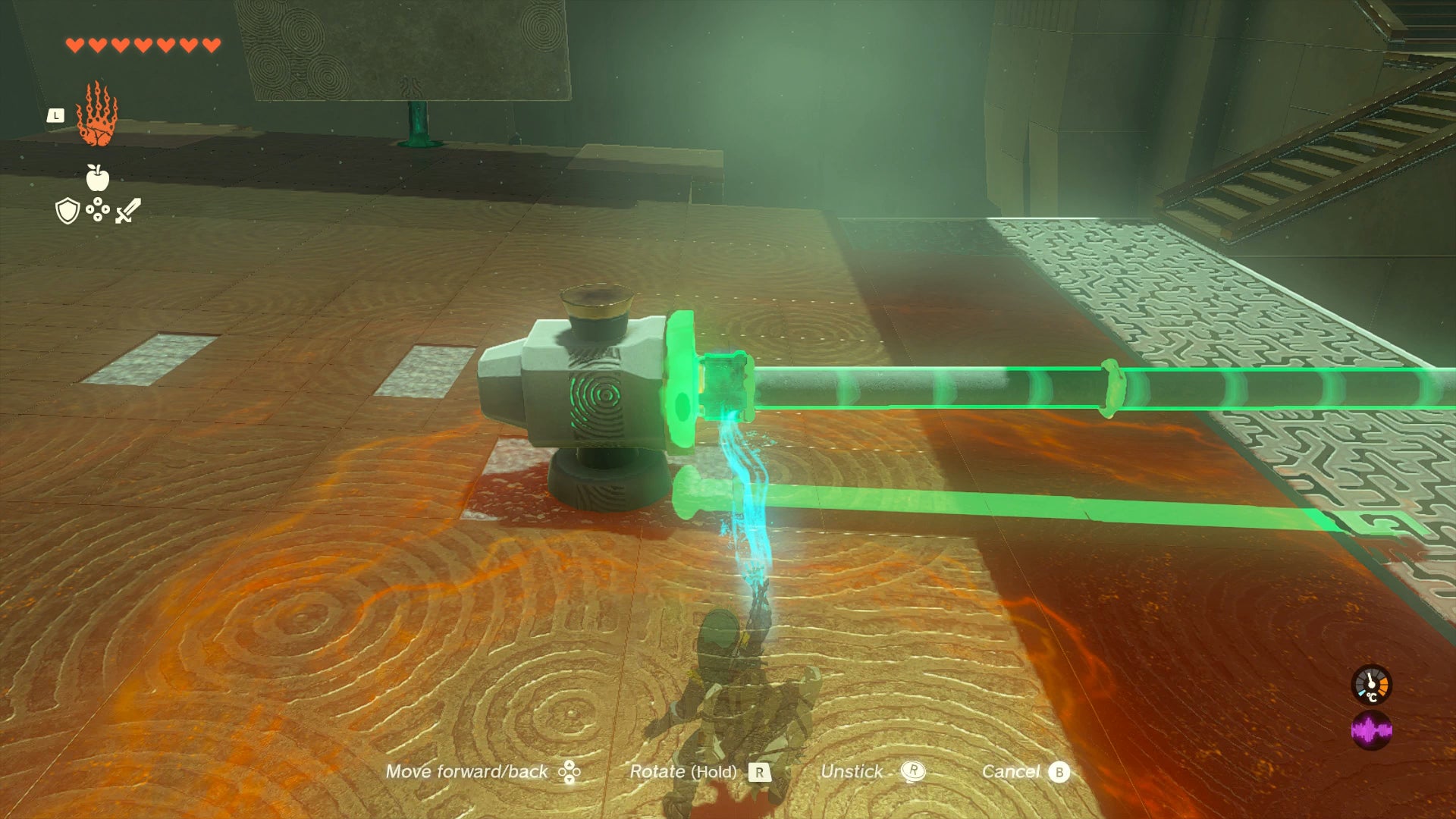 Link placing a stake inside a hammer device in Mayachin Shrine in Zelda: Tears of the Kingdom - 1