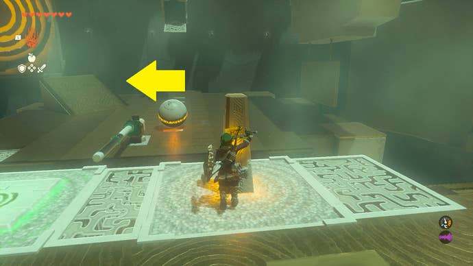 Link using a contraption to strike a ball into a target in Mayachin Shrine in Zelda: Tears of the Kingdom
