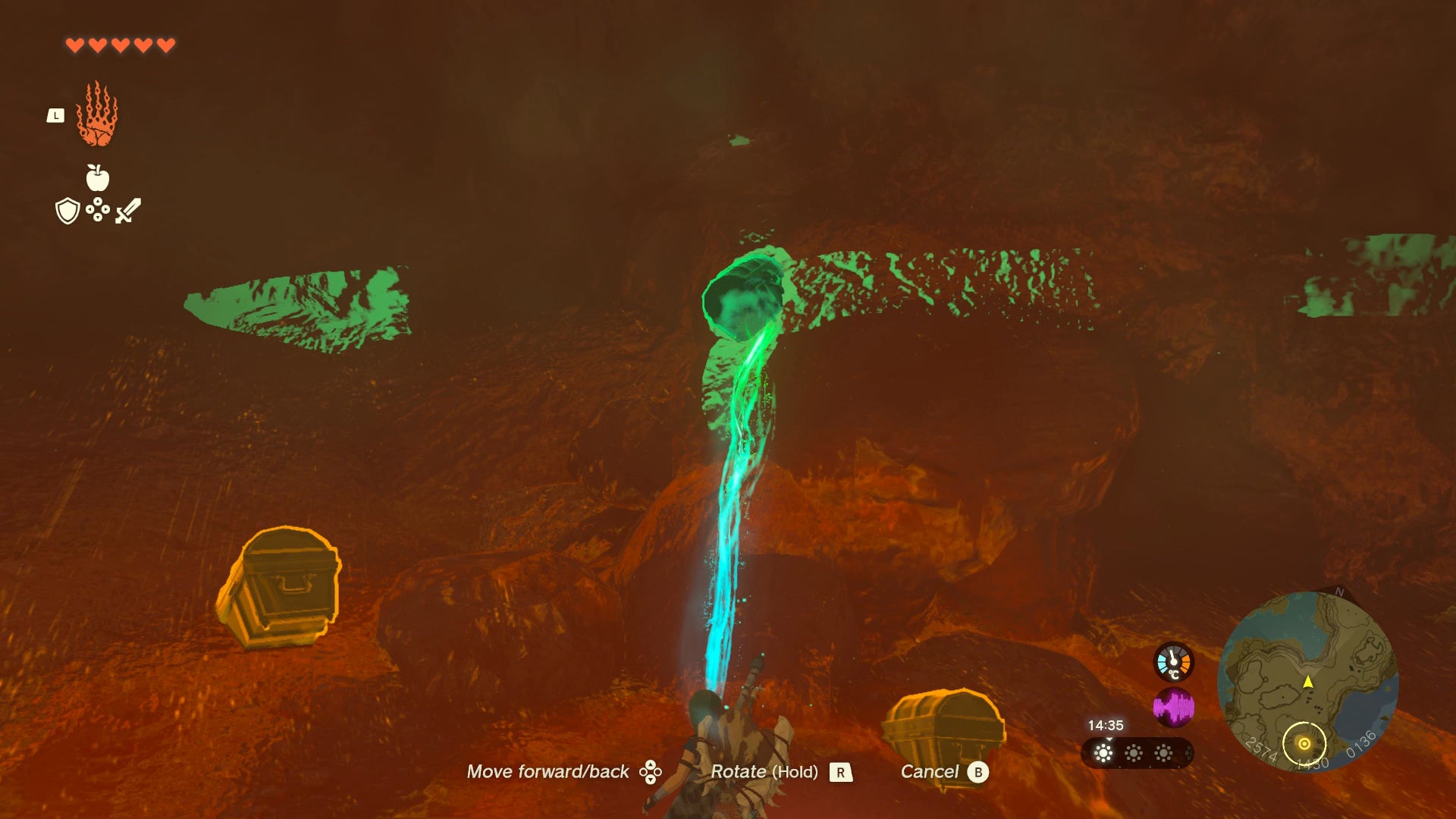 Link using Ultrahand to dislodge a chest from a cave wall - 4