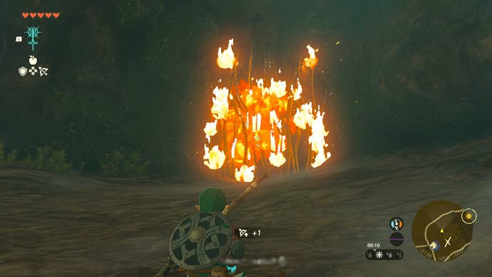 Link burning some vines in Zelda: Tears of the Kingdom