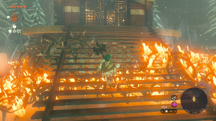Link burning away the bushes blocking Rospro Pass Skyview Tower in Zelda: Tears of the Kingdom