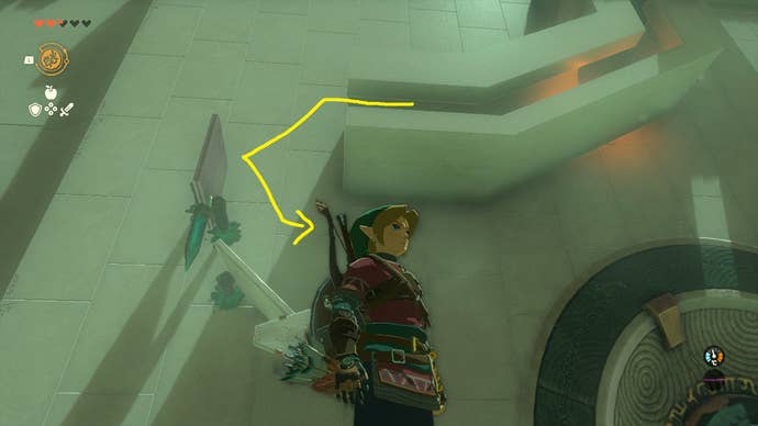 Link placing stakes with the Ultrahand power to knock a ball into a hole inside Tsutsu-um Shrine in Zelda: Tears of the Kingdom
