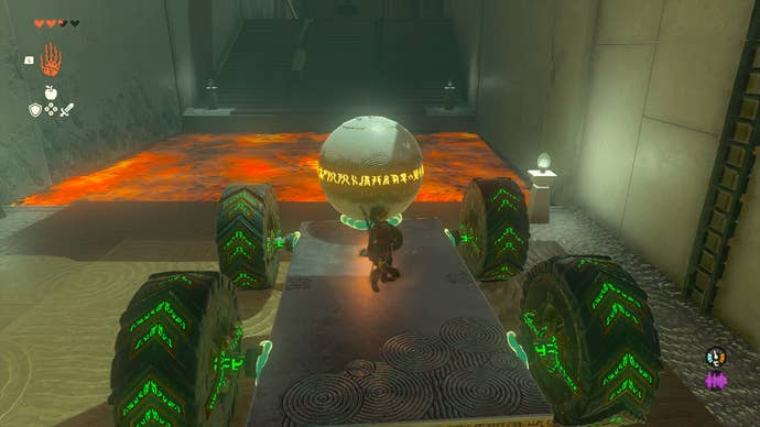 Linking riding a cart with a giant ball inside Tukarok Shrine in Zelda: Tears of the Kingdom