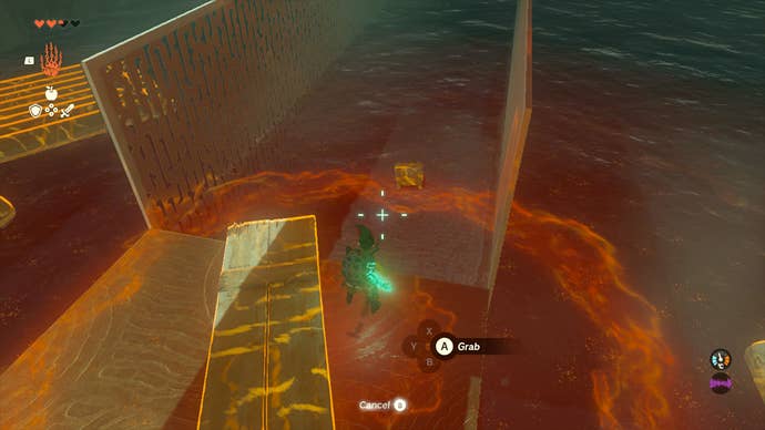 Link fishing a chest out of a pool of water inside Tukarok Shrine in Zelda: Tears of the Kingdom