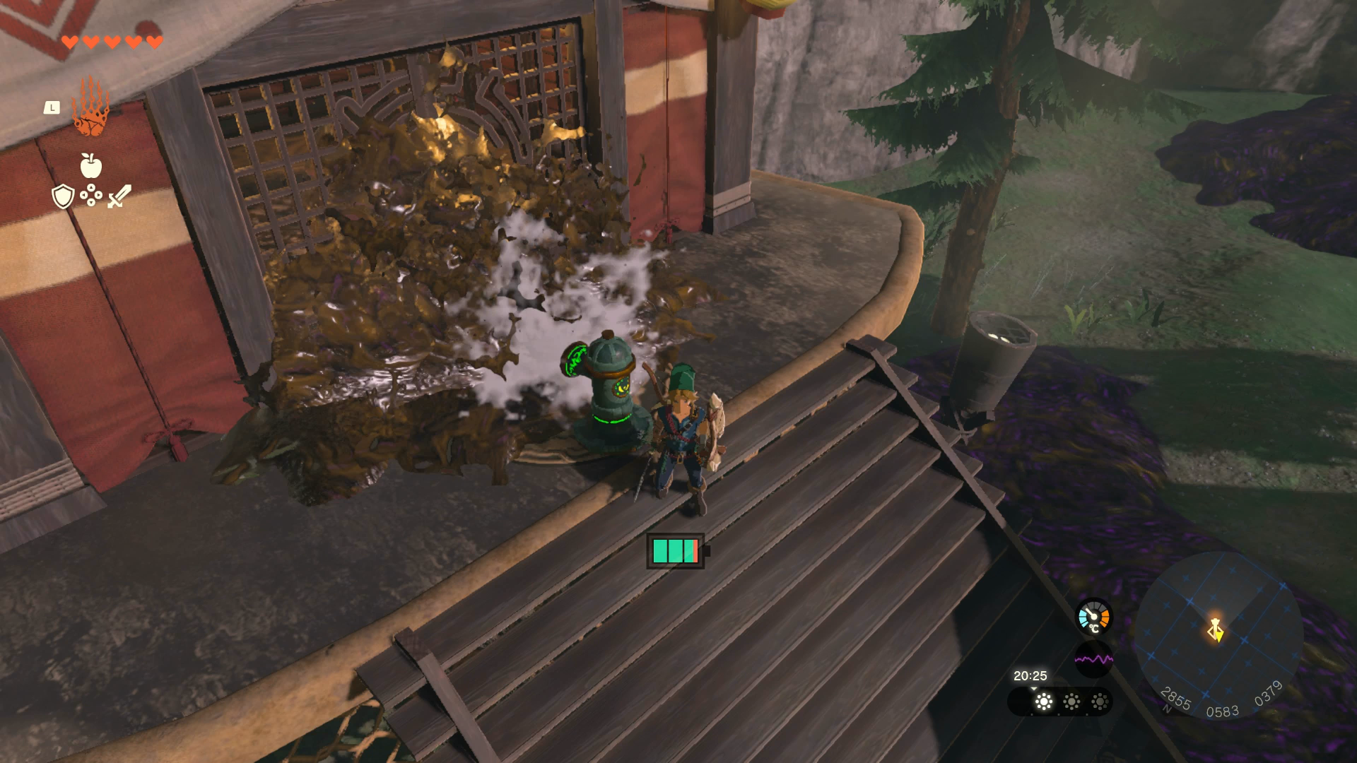 Link using water to wash away the muck covering Upland Zorana Skyview Tower in Zelda: Tears of the Kingdom