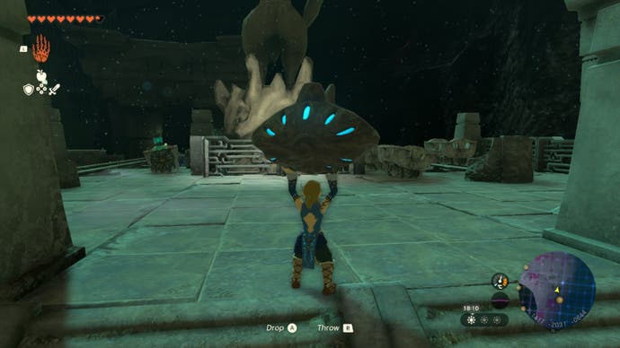 zelda totk link carrying eye to statue and rails area in the depths