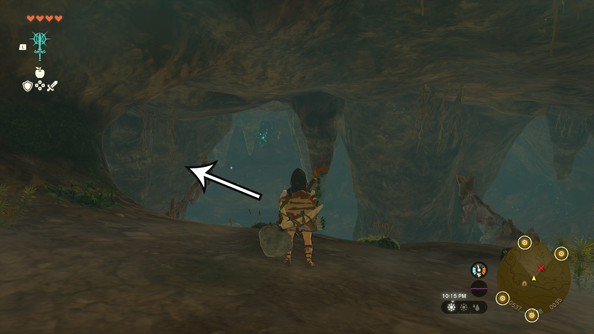 Link in the Crenel Hills Cave, with an arrow pointing in the direction players need to head to find the Barbarian Armor.